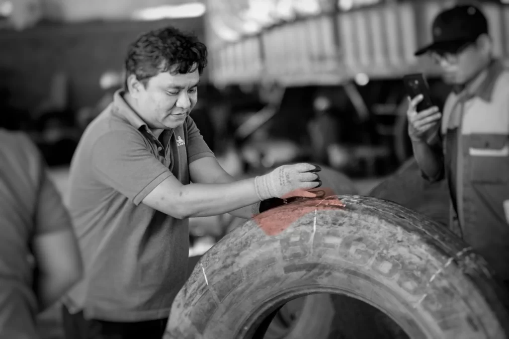 Expert tire regrooving training for technicians. Learn how to accurately measure tread depth on truck tires before grooving to extend tire life safely and professionally.