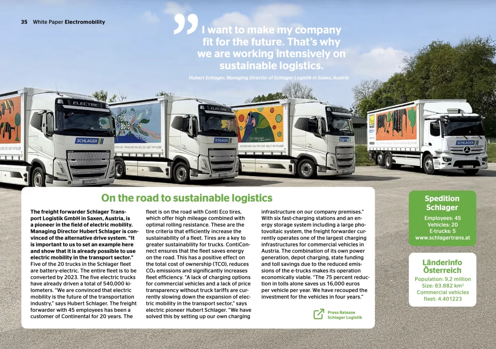 A fleet of white Schlager Logistik electric trucks with colorful artistic trailer designs parked at a logistics depot in Austria, illustrating sustainable transport.