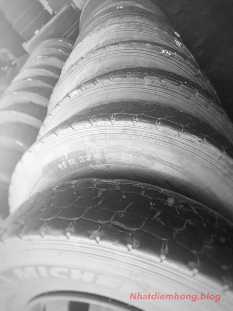 Truck tires removed during tire rotation service and measured for circumference matching before dual tire pairing