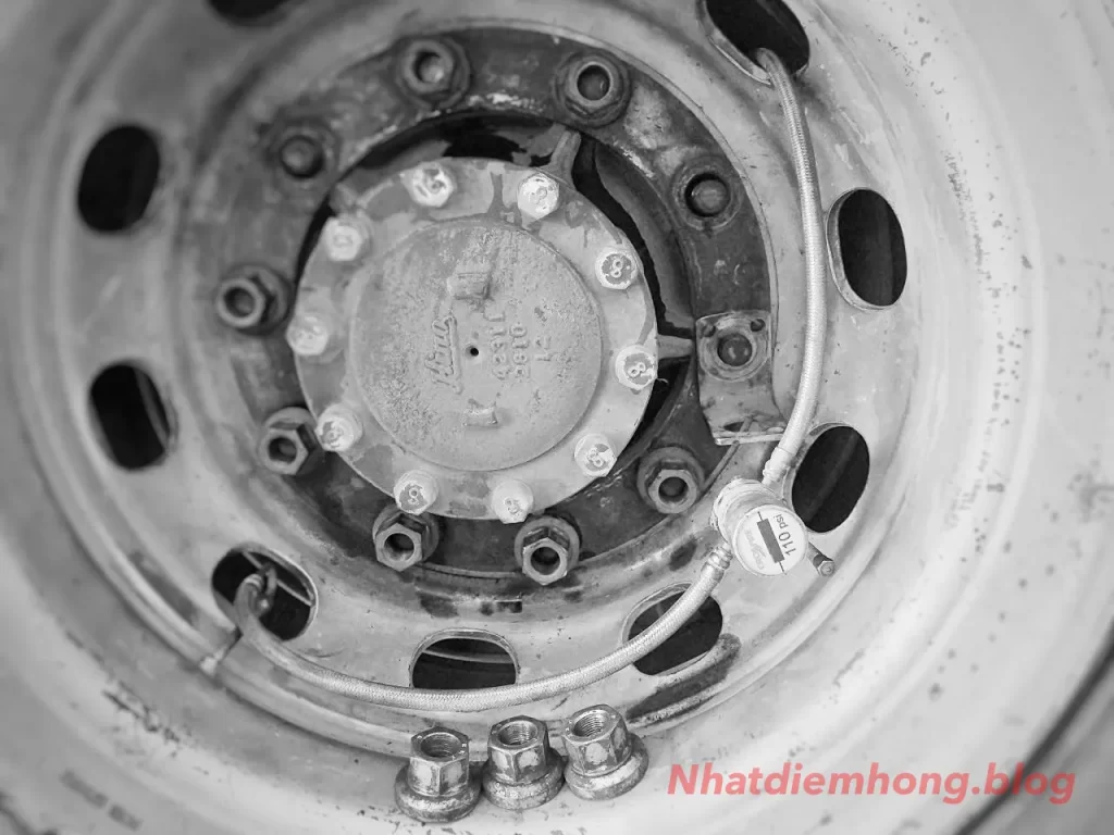 Truck dual tires matched by circumference and fitted with a tire pressure equalization system for improved tire rotation wear control