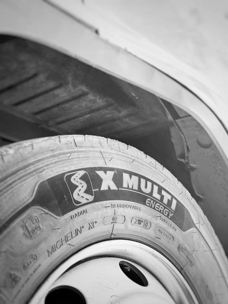 Michelin X Multi Energy truck tire sidewall showing tread pattern name and regroovable marking.