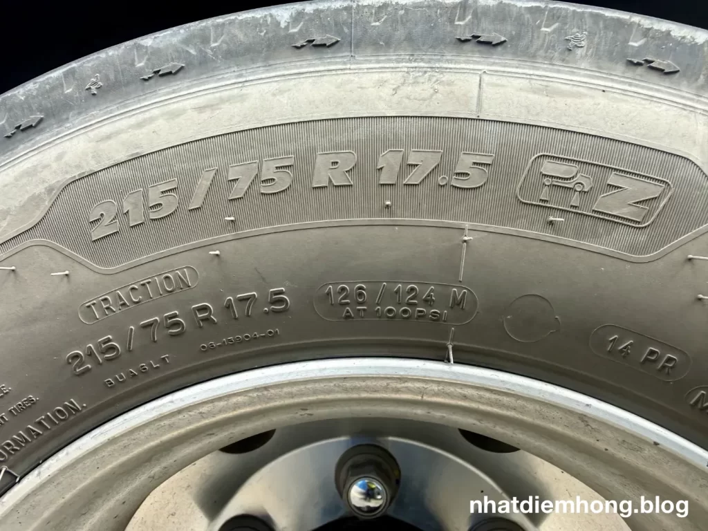 215/75R17.5 126/124M commercial truck tire sidewall showing load index, speed rating, and 100 PSI maximum pressure
